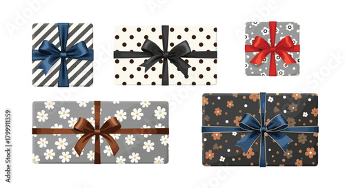 Collection of five decorative gift boxes with various patterns and ribbon bows, overhead view.