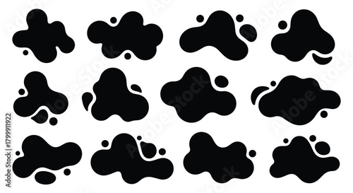 Collection of organic black ink blots and splatters on a white background.