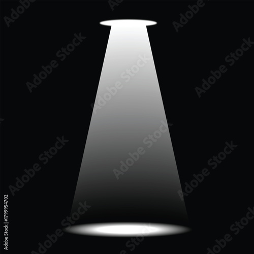 The image shows a darkened stage setup with three bright spotlights shining down onto the center area of its floor, casting illuminant beams of light in an otherwise dark space.