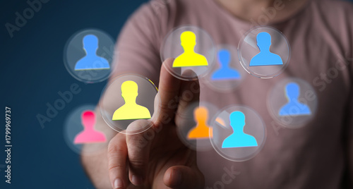 Hand selecting a person fro...