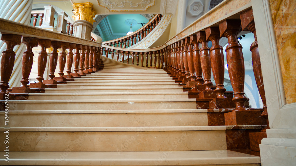 Naklejka premium bottom view of the columns and stairs of the building classic interior design