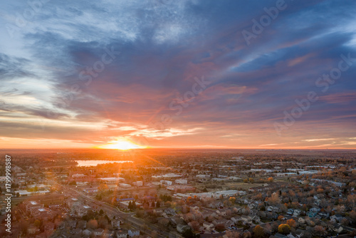 sunrise over midtown of Fort Collins and plains in northern Colorado, November aerial view