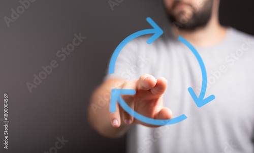 A man's hand touching a rec...