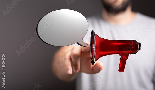 Person holding a red megaph...