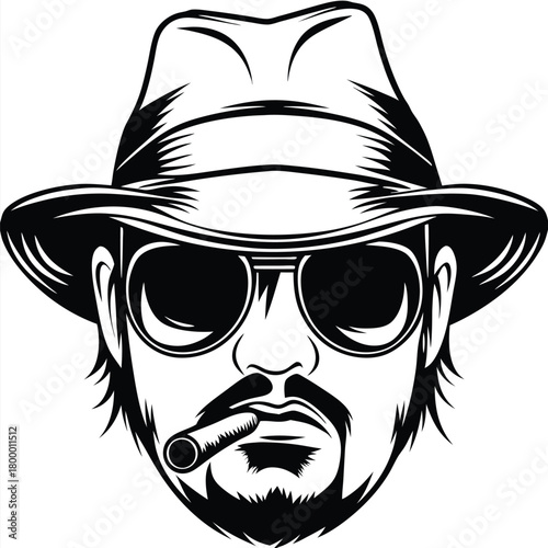 Bearded man wearing hat and sunglasses smokes a cigar in black and white