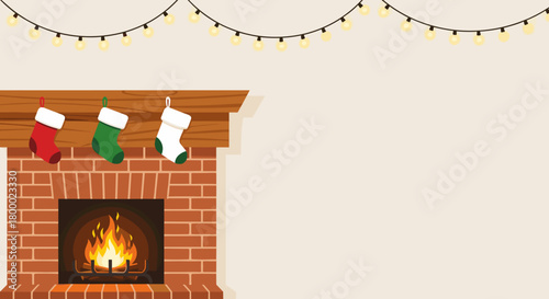 Hanging Christmas stockings by the fireplace with bright flames and yellow lights background copy space