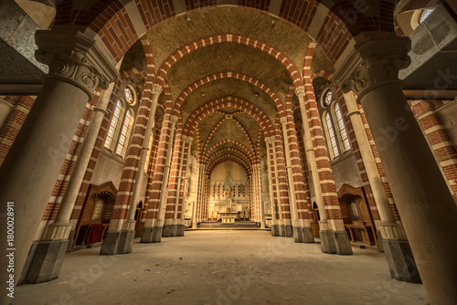 Abandoned Romanesque Monastery Church Interior with Brick Arches, Vaulted Ceiling and Ornate Altar