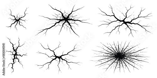 Various black crack patterns on white background, simulating broken glass or shattered surfaces