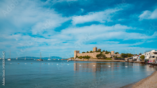 Fototapeta Naklejka Na Ścianę i Meble -  Bodrum Castle and sailboats on a calm blue sea in Bodrum, Turkey