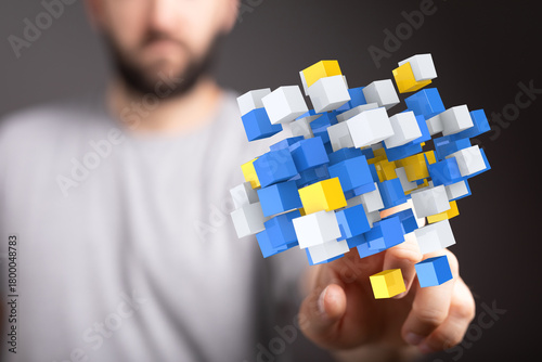 Man touching colorful abstr...
