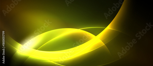 Abstract yellow curves shine against dark background. Smooth lines create dynamic, flowing visual effect. Brightness emphasizes central focal point.