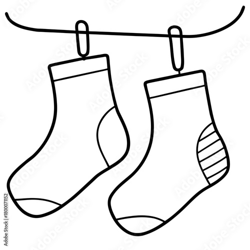 Two socks are hanging on a clothesline
