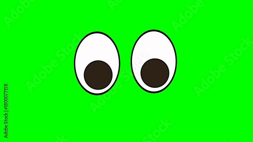 Animation or computer graphics of a winking eye on a green chromakey background for insertion