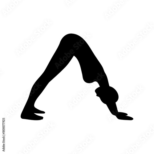 Silhouette of a person doing the DownwardFacing Dog yoga pose gracefully