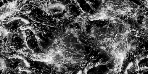 Aerial view. Black and white. Waves breaking against the rocks. Maelstrom, natural phenomenon of whirlpool, 