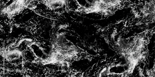 Aerial view. Black and white. Waves breaking against the rocks. Maelstrom, natural phenomenon of whirlpool, 
