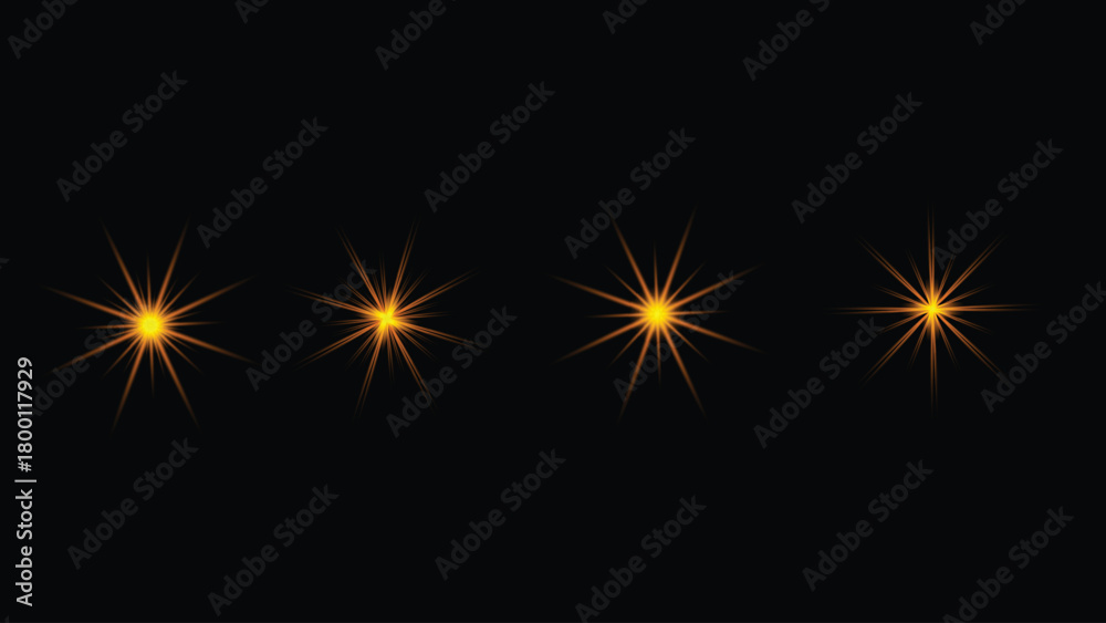 Fototapeta premium Four golden starburst light effect elements glowing brightly