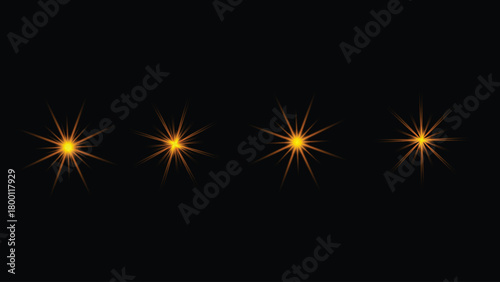 Four golden starburst light effect elements glowing brightly