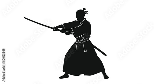 Silhouette of a samurai warrior poised with a katana in a dynamic stance
