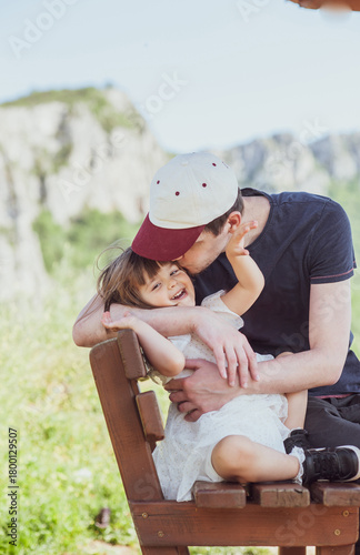 A father and a daughter are having a great time in nature

