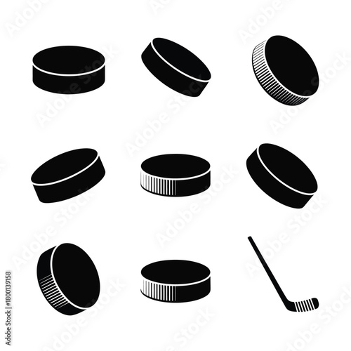 A collection of hockey pucks and a hockey stick are displayed against a white background.