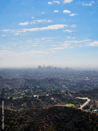 Skyline of Los Angeles as seen from the Wonder View Trailhead to Wisdom Tree on Cahuenga Peak during a summer season in Los Angeles, California, USA