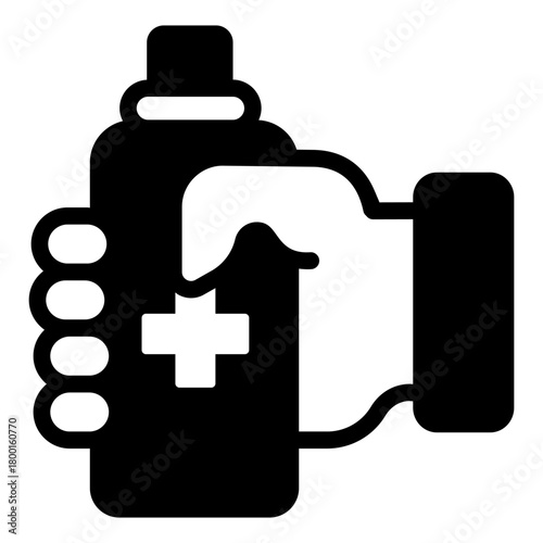 Bottle of antiseptic in hand solid icon, medicine concept. Vector graphics. Antiseptic bottle with medical cross sign on white background, style icon mobile or web design.