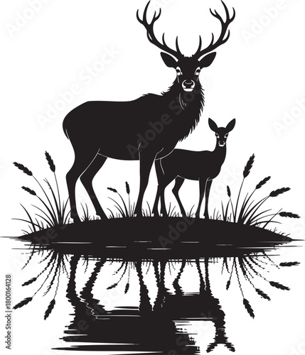 A striking black silhouette of a large stag and a smaller fawn stand on a grassy bank, their reflections mirrored in the water below.