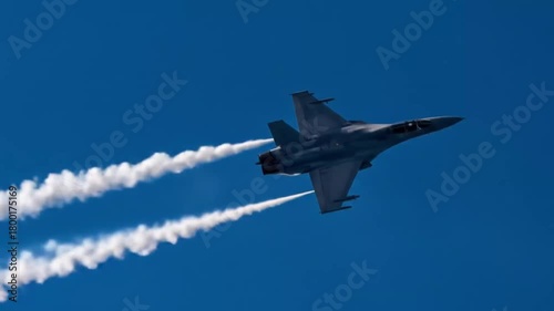 Fighter Jet Soaring Through the Sky Leaving Vapor Trails.