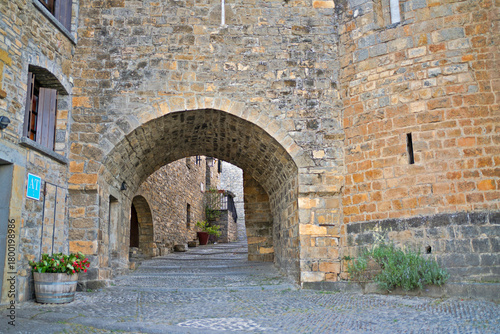 Ainsa old town archway stone street