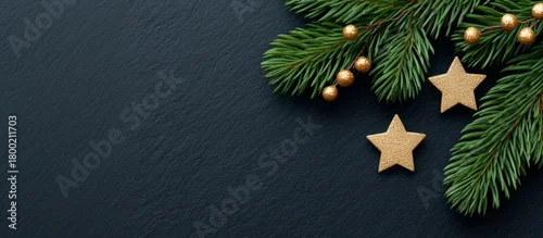 Panel kuchenny z motywem Christmas decorations with fir branches and golden stars on a dark slate background. Festive holiday flat lay. Winter season concept with space for text