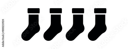 Flat vector illustration four thermal socks black and white solid black icon style contrast cuffs implied 4x1 grid equal spacing isolated on white