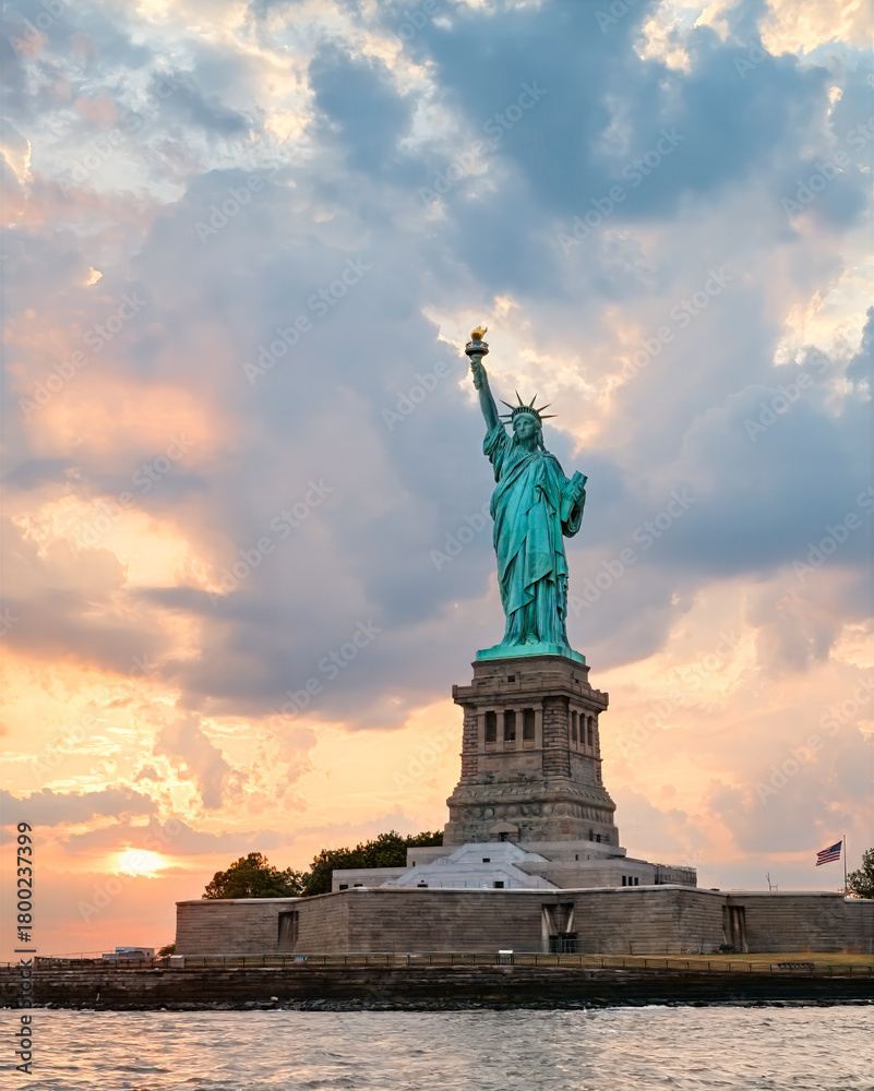 Fototapeta premium State of Liberty at sunset in from New York Harbor
