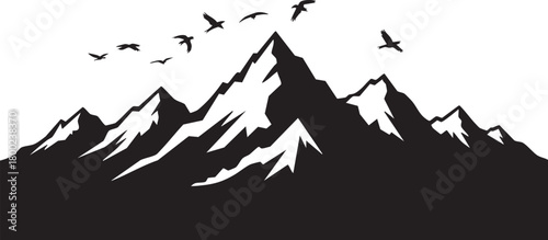 Mountain peaks under a flock of birds showcase the beauty of nature in silhouette