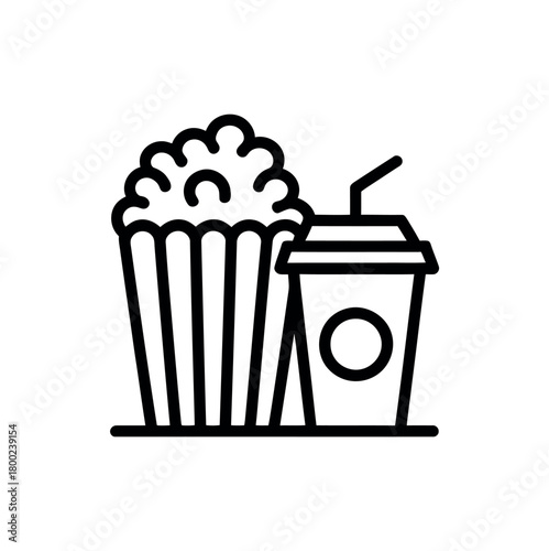 A single serving of popcorn is next to a drink in a cup with a straw.