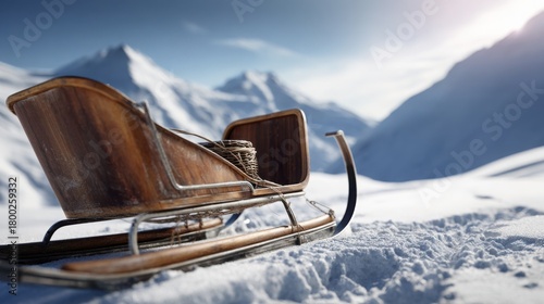 close up of classic wooden sleigh with metal runners gleaming in sunlight, placed on pristine snow, bright winter mountains in background, crisp