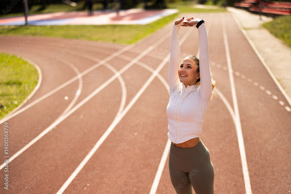Fototapeta premium Athlete Woman Stretching Before Run