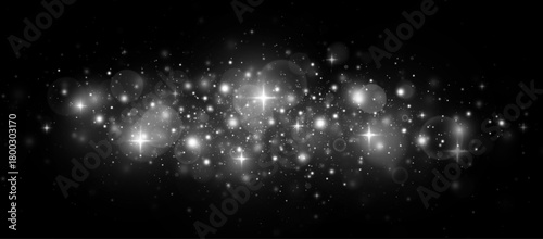 Fantasy night with bright silver particles and sparkling stardust. Festive scene with shimmering confetti and glowing lights.