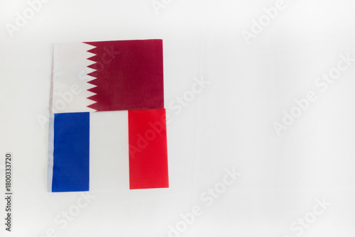 Free Download Qatar and France flags in white background with copy space - GFXLoad