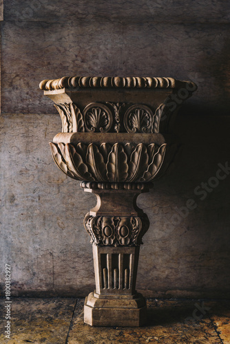 Antique ornamental stone vase in classical architectural style