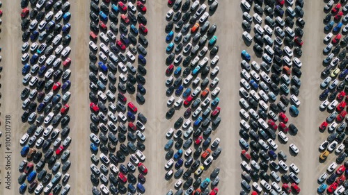Car parking lot filled with various vehicles showcasing different colors and models from above at Copart yard, York, North Yorkshire.