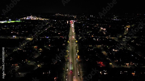 Nighttime city skyline with busy streets and illuminated buildings in a vibrant urban area