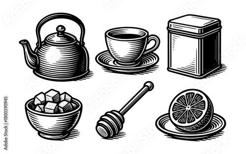 Vintage tea set with teapot, cup, sugar bowl, honey dipper, and lemon