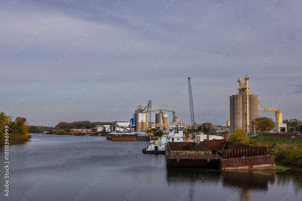 Obraz premium Barges At A Grain Loading Facility Along The Mississippi River