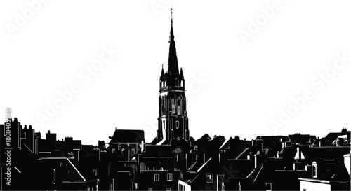 Striking silhouette of a historic European town with a prominent church spire against a bright sky.