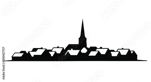 Charming silhouette of a quaint village with a prominent church spire at sunset.