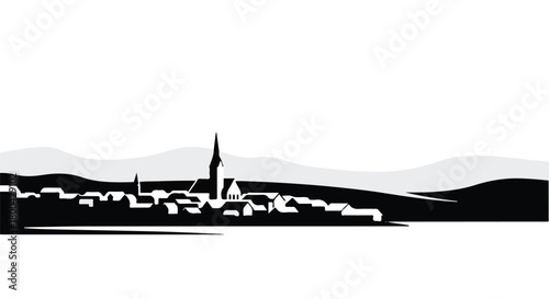 Serene silhouette of a charming European village nestled against rolling hills