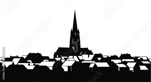 Silhouette of a quaint European village with a prominent church steeple against a bright sky