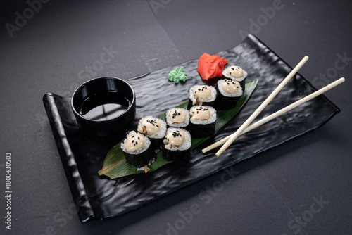 Japanese rolls, fish, black background
