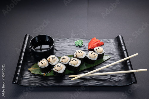 Japanese rolls, fish, black background